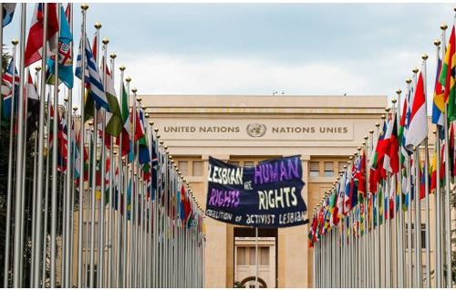 Coalition of Activist Lesbians, United nations banner with lesbian flag outside of UN, New York