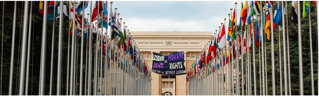 Coalition of Activist Lesbians, United nations banner with lesbian flag outside of UN, New York